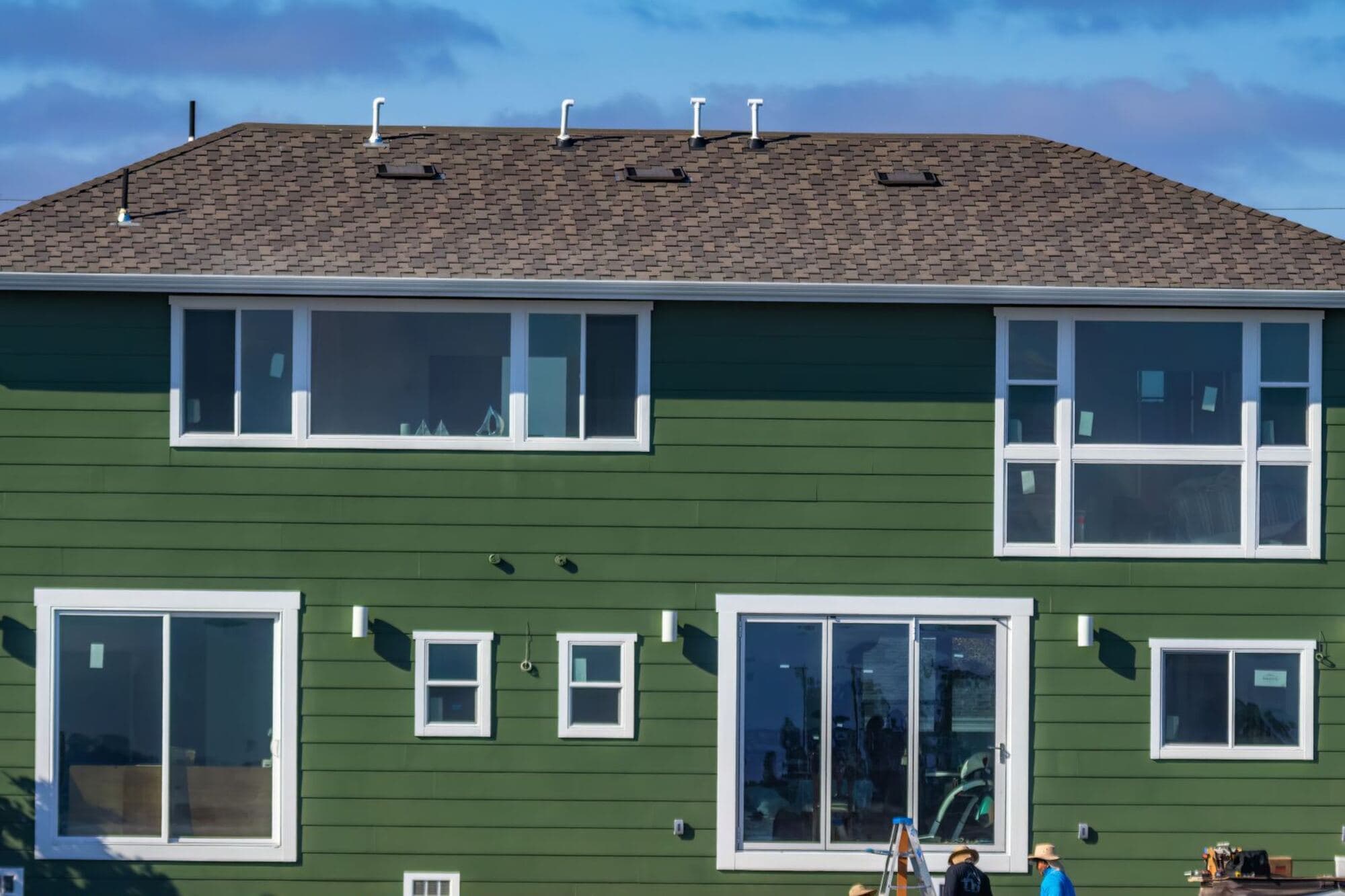 New siding and windows on a two-story house